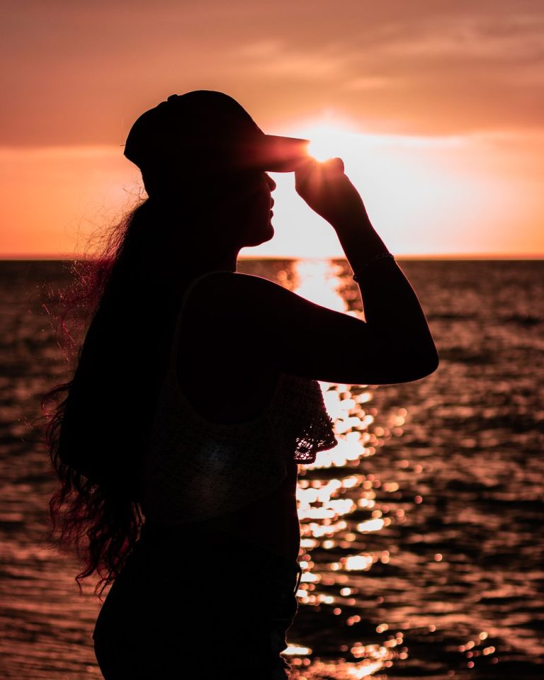 Woman in a bikini by the water