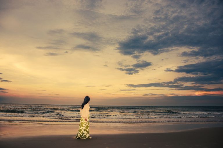 Woman in a bikini by the water