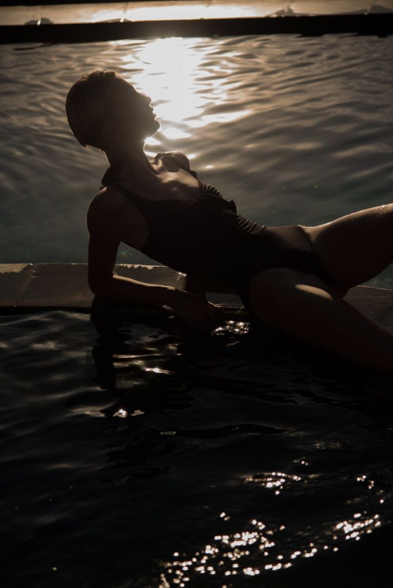 Woman in a bikini by the water